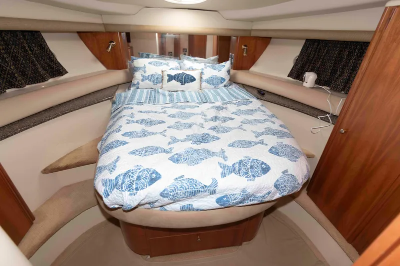 Slide: The Image of Cozy bedroom in 2004 Meridian 408 Motoryacht with fish-patterned bedding. - 21