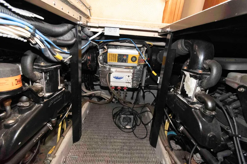 Slide: The Image of Engine room of 2004 Meridian 408 Motoryacht with visible wiring and machinery. - 23