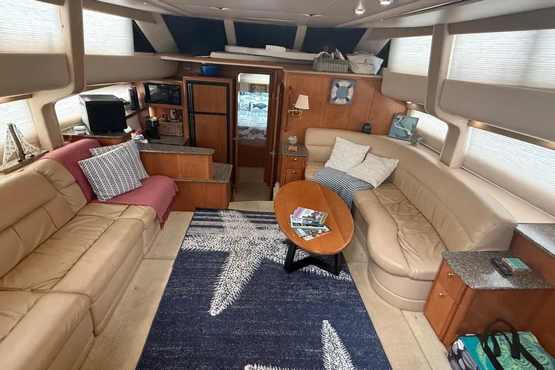 Slide: The Image of 2004 Meridian 408 Motoryacht helm with panoramic marina view and plush seating. - 5