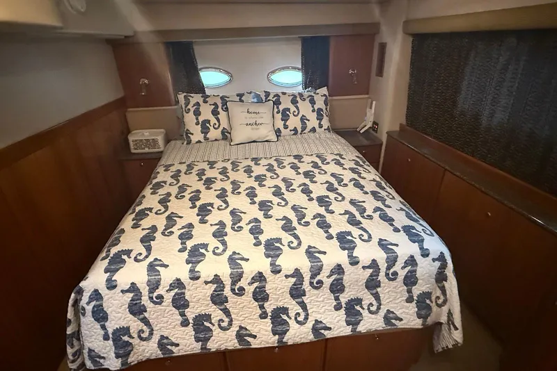 Slide: The Image of 2004 Meridian 408 Motoryacht helm with wooden steering wheel and modern navigation displays. - 8