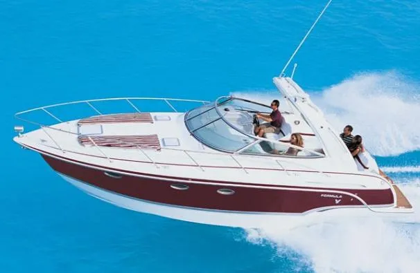 Slide: The Image of 2008 Formula 31 Performance Cruiser docked with American flag, marina backdrop. - 0