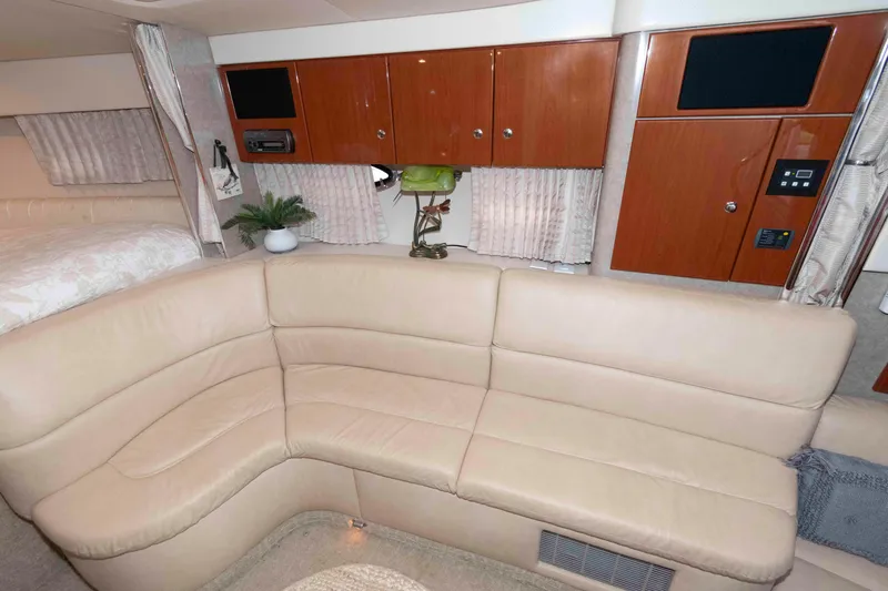 Slide: The Image of 2008 Formula 31 Performance Cruiser interior with beige leather seating and wooden cabinetry. - 14