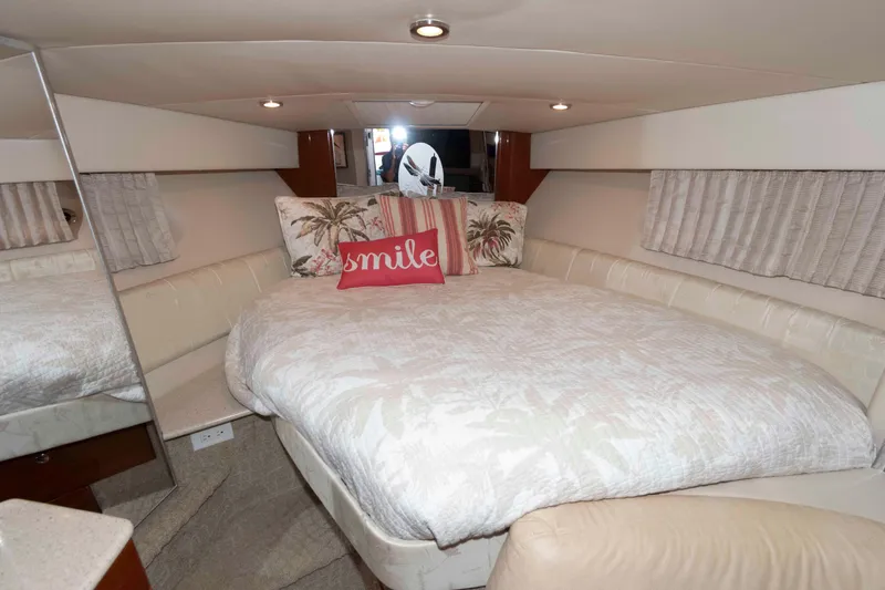 Slide: The Image of 2008 Formula 31 Performance Cruiser cabin with cozy bed and decorative pillows. - 15