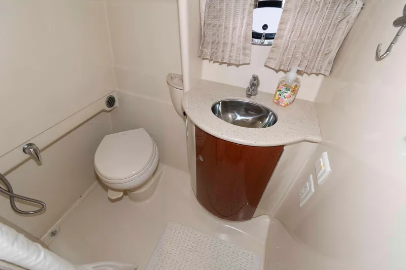 Slide: The Image of 2008 Formula 31 Performance Cruiser bathroom with sink, toilet, and window. - 18