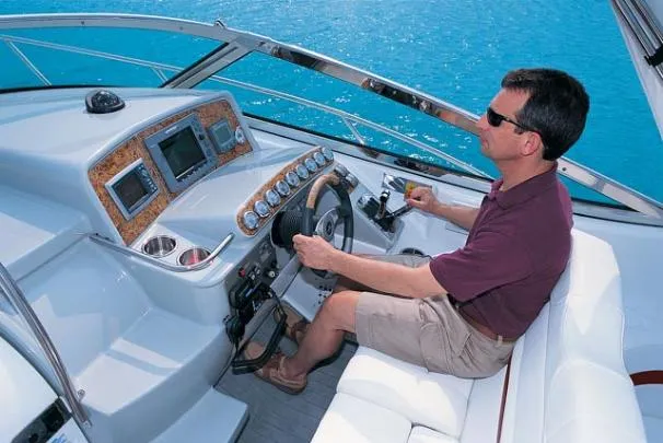 Slide: The Image of 2008 Formula 31 Performance Cruiser docked at marina with American flag. - 2