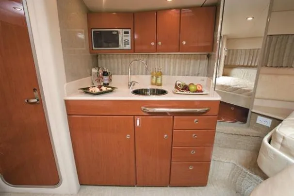 Slide: The Image of 2008 Formula 31 Performance Cruiser interior with white seating and dining area. - 4