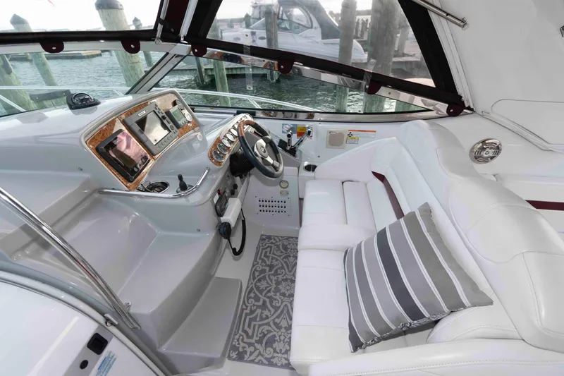 Slide: The Image of 2008 Formula 31 Performance Cruiser cockpit with white seating and modern dashboard. - 7