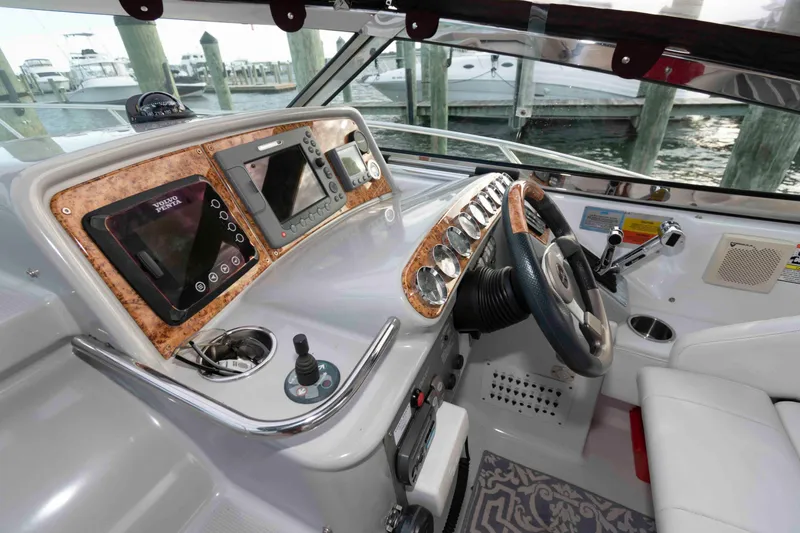Slide: The Image of 2008 Formula 31 Performance Cruiser helm with modern controls and navigation systems. - 8