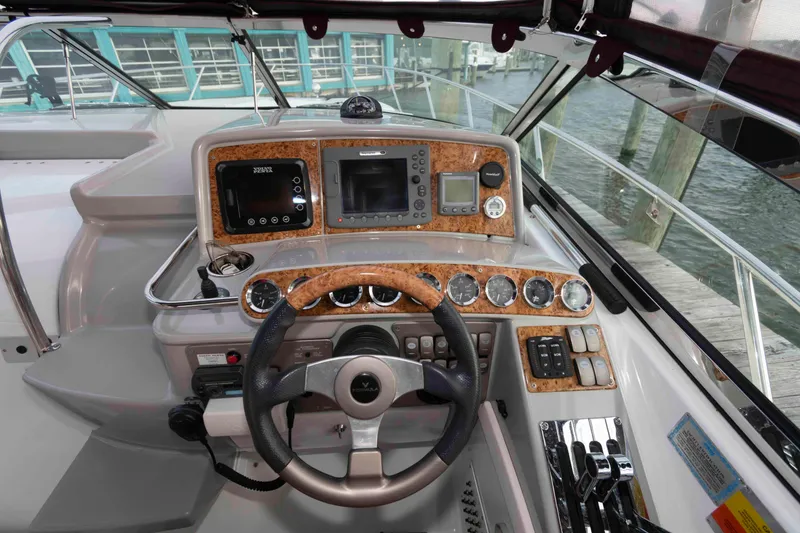 Slide: The Image of 2008 Formula 31 Performance Cruiser helm with advanced controls and navigation instruments. - 9