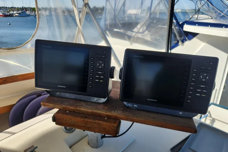 Slide: The Image of 1977 Post Sport Fish boat with Garmin navigation displays in the cockpit. - 10