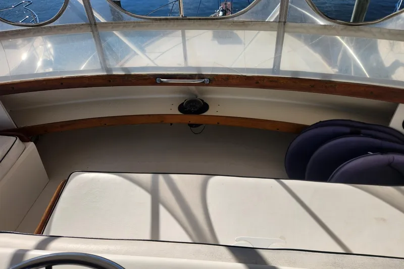 Slide: The Image of 1977 Post Sport Fish boat interior with seating and wooden accents. - 12