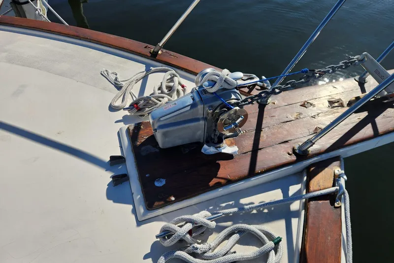 Slide: The Image of 1977 Post Sport Fish boat deck with anchor winch and ropes. - 16