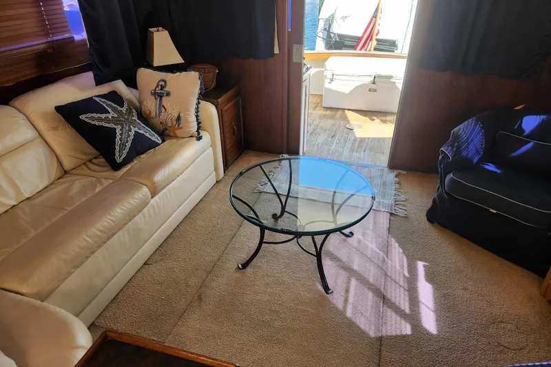 Slide: The Image of Interior of 1977 Post Sport Fish boat with cozy seating and nautical decor. - 21