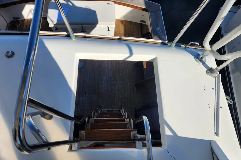 Slide: The Image of 1977 Post Sport Fish boat interior with ladder and deck view. - 8