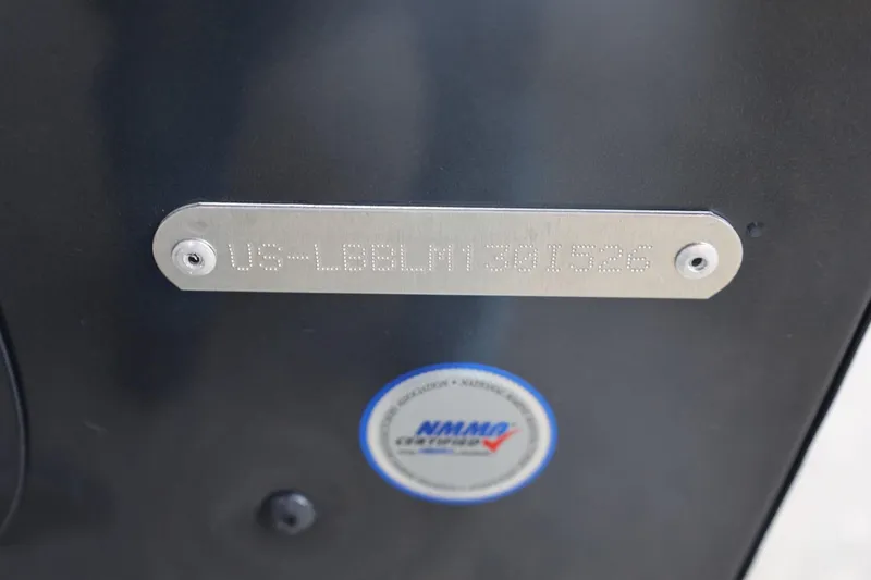 Slide: The Image of 2026 Lund 1775 Adventure Sport hull identification number and NMMA certification label. - 13