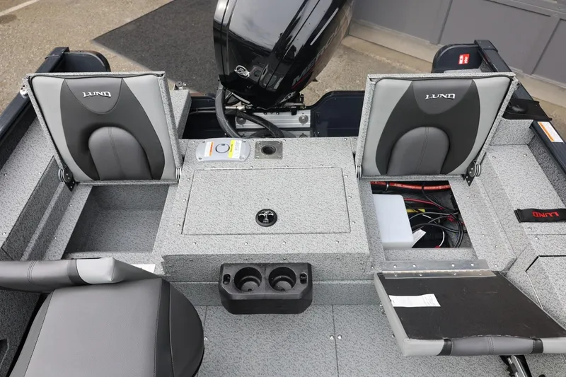 Slide: The Image of 2026 Lund 1775 Adventure Sport boat interior with seating and storage compartments. - 20