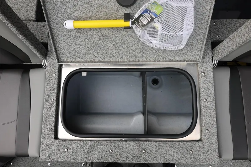 Slide: The Image of 2026 Lund 1775 Adventure Sport boat interior with open storage compartment and fishing net. - 21