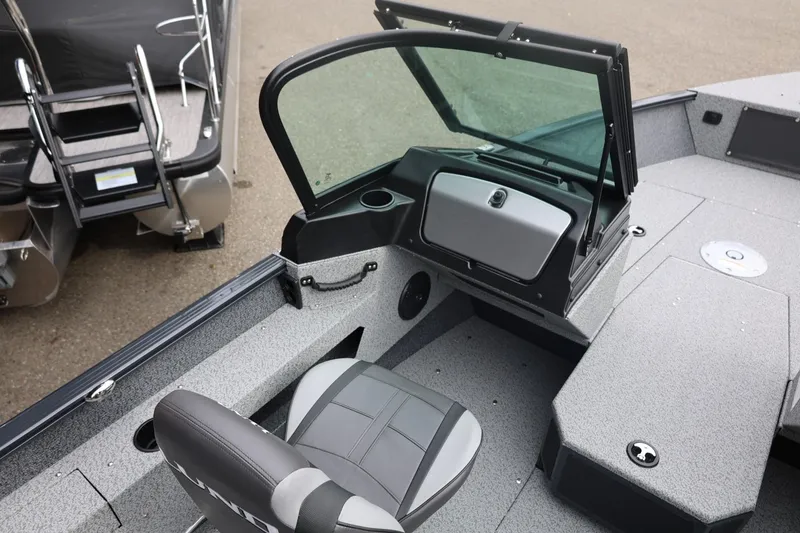 Slide: The Image of 2026 Lund 1775 Adventure Sport boat interior with seating and windshield. - 24