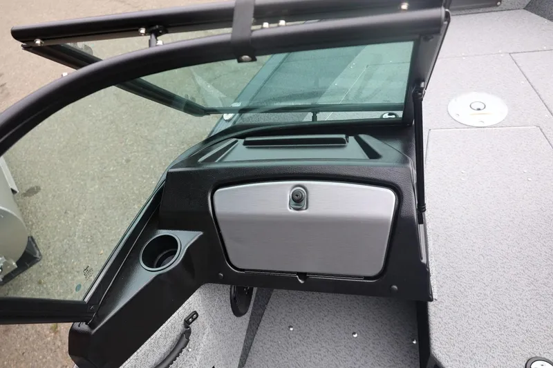 Slide: The Image of 2026 Lund 1775 Adventure Sport boat interior with windshield and storage compartment. - 25