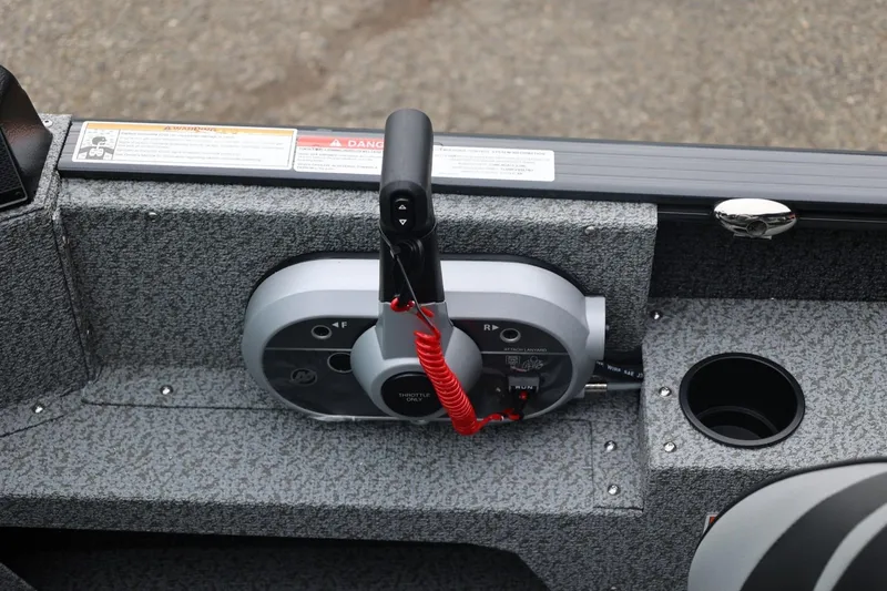 Slide: The Image of Control panel of 2026 Lund 1775 Adventure Sport boat with throttle and cup holder. - 29