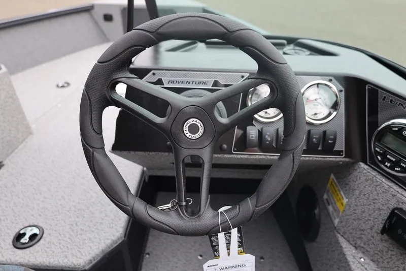 Slide: The Image of 2026 Lund 1775 Adventure Sport steering wheel and dashboard close-up. - 33