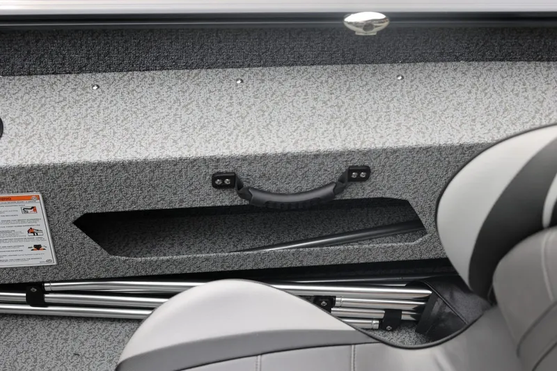 Slide: The Image of Interior of 2026 Lund 1775 Adventure Sport boat showing storage compartment and seating. - 34