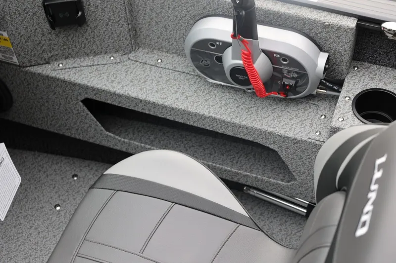 Slide: The Image of 2026 Lund 1775 Adventure Sport boat interior with control panel and seating. - 35