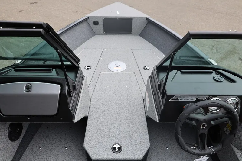 Slide: The Image of 2026 Lund 1775 Adventure Sport boat interior with open windshield and steering wheel. - 36