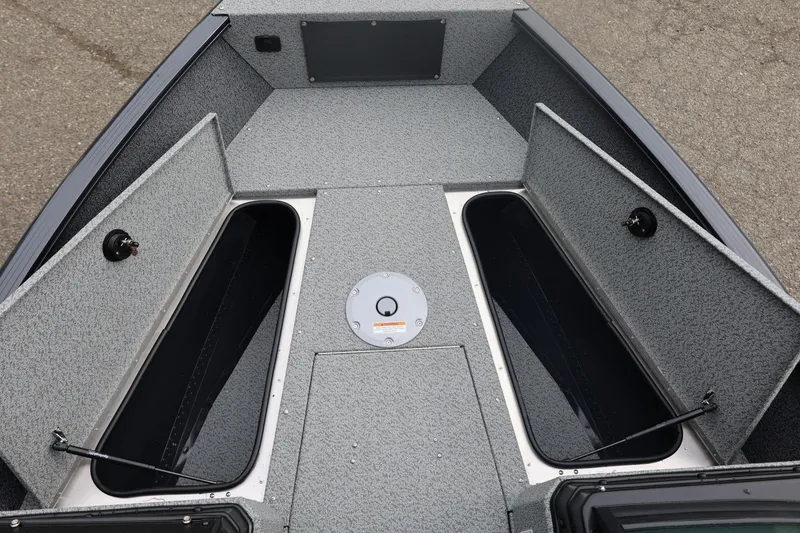 Slide: The Image of 2026 Lund 1775 Adventure Sport boat interior with open storage compartments. - 39