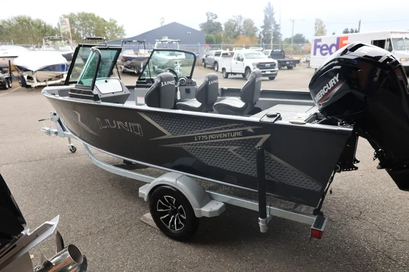Slide: The Image of 2026 Lund 1775 Adventure Sport boat on trailer, featuring Mercury outboard motor. - 9