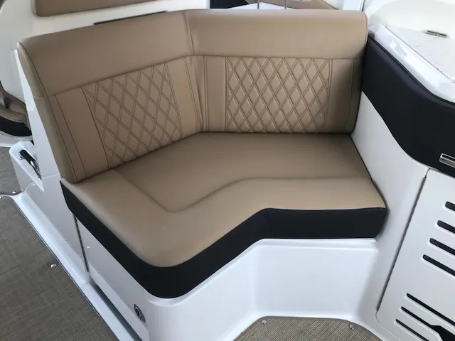 Slide: The Image of Luxurious tan seating on 2019 Sea Ray 310 SLX boat, featuring diamond stitching. - 12