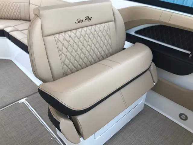 Slide: The Image of Luxurious beige seating on 2019 Sea Ray 310 SLX boat, featuring diamond stitching. - 13