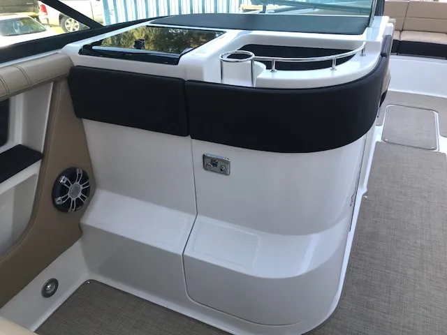 Slide: The Image of 2019 Sea Ray 310 SLX boat interior with seating and speaker detail. - 14
