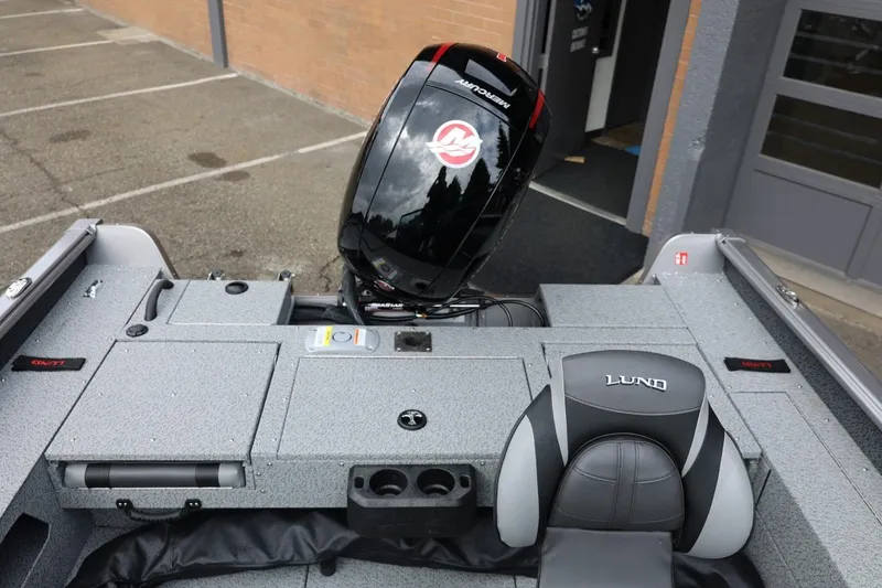 Slide: The Image of 2026 Lund 1875 Impact XS Sport boat interior with Mercury outboard motor. - 20