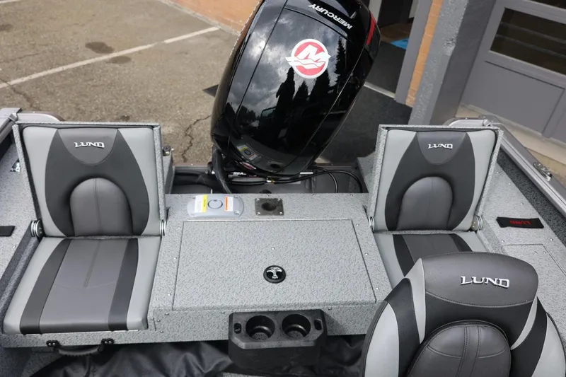 Slide: The Image of 2026 Lund 1875 Impact XS Sport boat interior with Mercury engine and comfortable seating. - 21