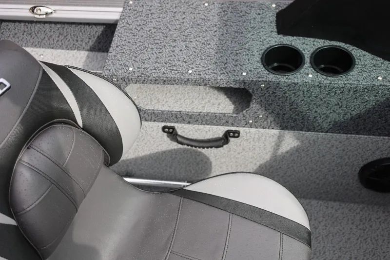 Slide: The Image of 2026 Lund 1875 Impact XS Sport boat interior with gray seating and cup holders. - 31