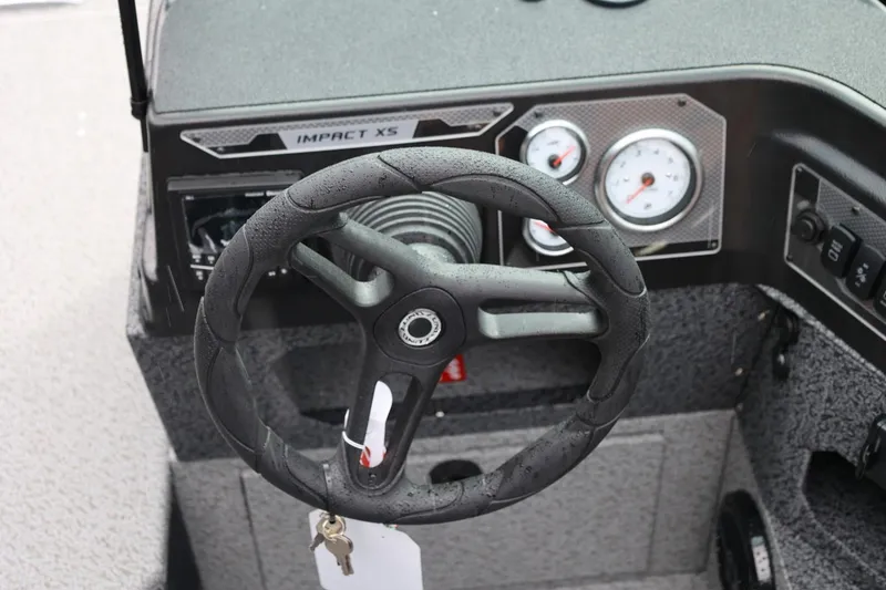 Slide: The Image of Steering wheel and dashboard of 2026 Lund 1875 Impact XS Sport boat. - 36