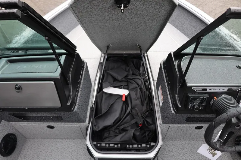 Slide: The Image of 2026 Lund 1875 Impact XS Sport boat interior with open storage compartments. - 43