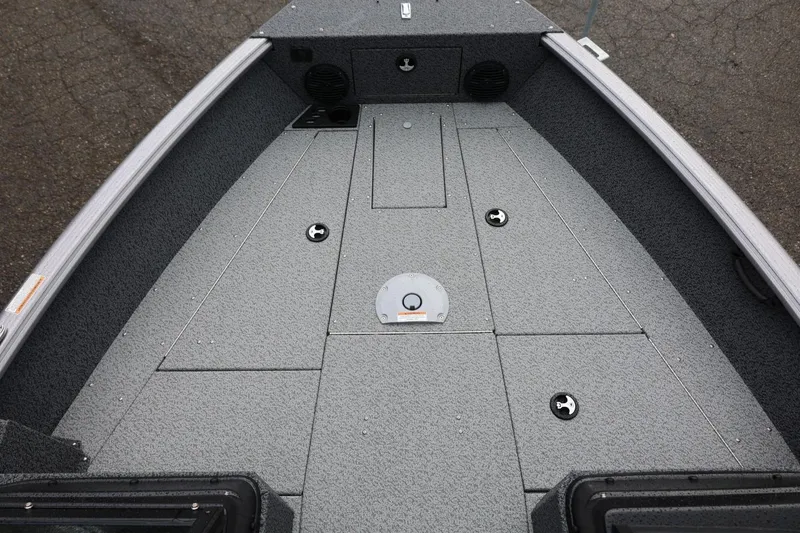 Slide: The Image of 2026 Lund 1875 Impact XS Sport boat deck, featuring spacious storage compartments. - 46