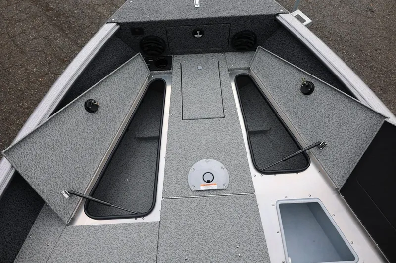 Slide: The Image of 2026 Lund 1875 Impact XS Sport boat interior with open storage compartments. - 47