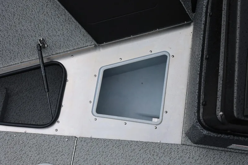 Slide: The Image of 2026 Lund 1875 Impact XS Sport boat interior storage compartment detail. - 48