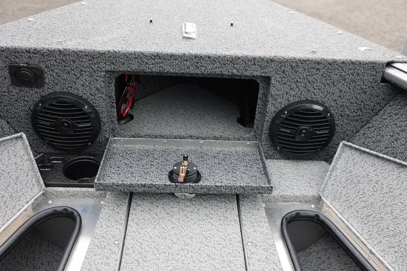 Slide: The Image of 2026 Lund 1875 Impact XS Sport boat interior with speakers and storage compartments. - 50