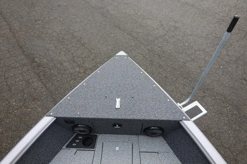 Slide: The Image of Bow view of 2026 Lund 1875 Impact XS Sport boat on pavement. - 51