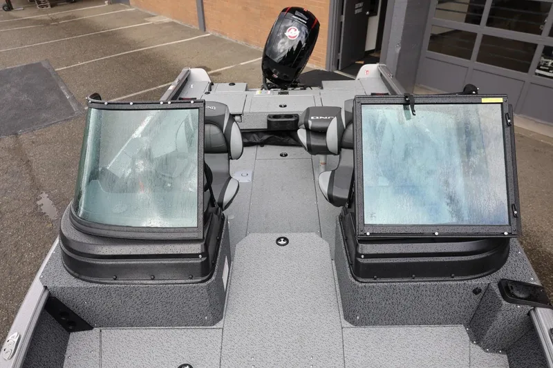 Slide: The Image of 2026 Lund 1875 Impact XS Sport boat interior with dual windshields and seating. - 52