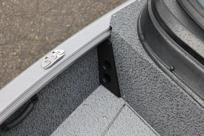 Slide: The Image of Close-up of 2026 Lund 1875 Impact XS Sport boat interior with textured flooring. - 53