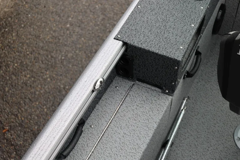 Slide: The Image of 2026 Lund 1875 Impact XS Sport boat interior with textured flooring and sleek design. - 57