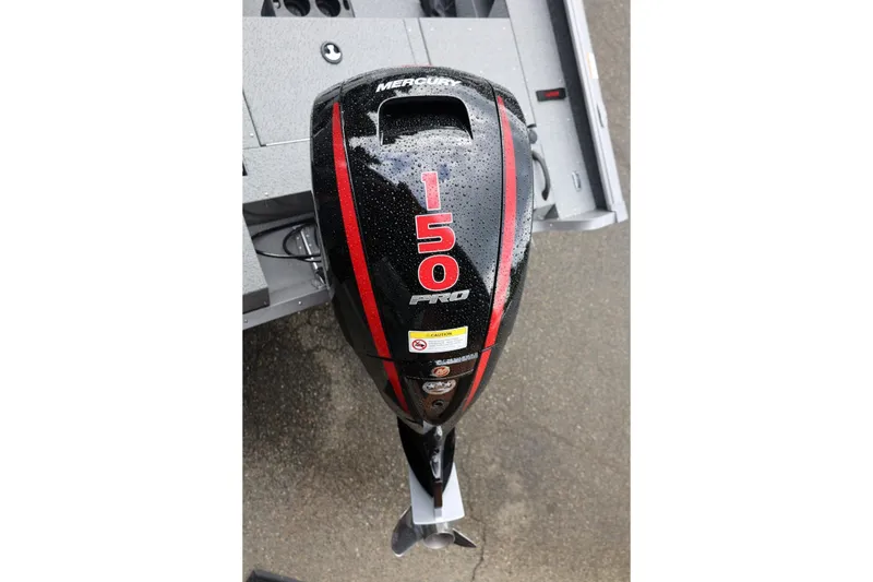 Slide: The Image of Outboard motor on 2026 Lund 1875 Impact XS Sport boat, featuring Mercury 150 Pro. - 58