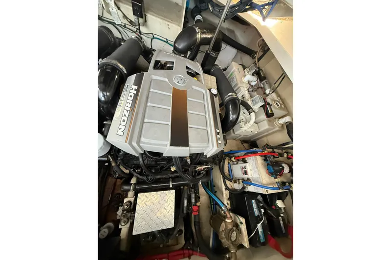 Slide: The Image of Engine compartment of a 2009 Sea Ray 350 Sundancer boat, featuring Horizon 8.1 engine. - 23