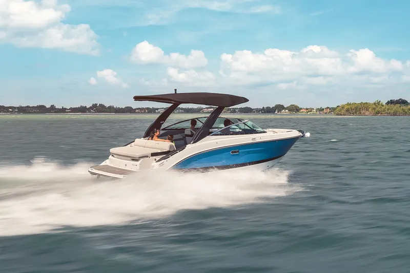 Slide: The Image of Manufacturer Provided Image: 2024 Sea Ray SLX 260 boat cruising on open water. - 2