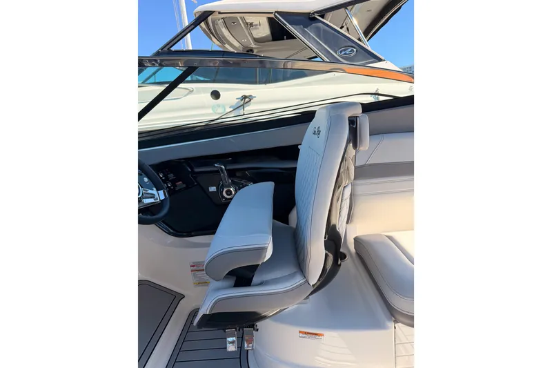 Slide: The Image of 2024 Sea Ray SLX 260 boat interior with modern helm and seating. - 32